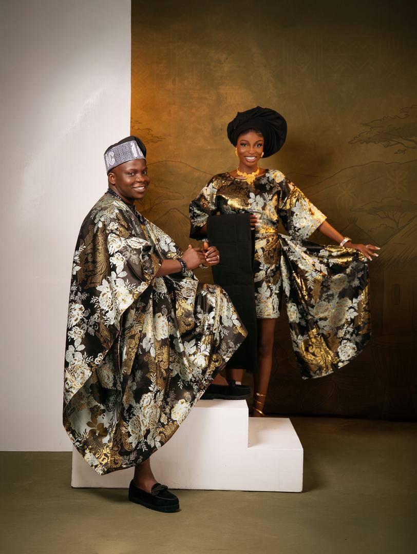 Couple in black and gold agbada and iro